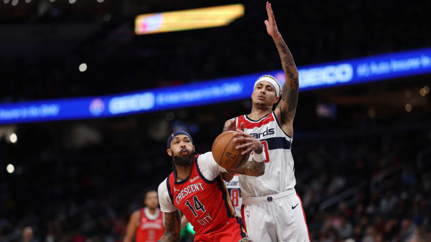 New Orleans Pelicans forward Brandon Ingram (14) fakes Washington Wizards forward Kyle Kuzma (33) in the third quarter at Capital One Arena. 